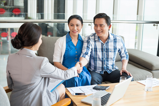 Couple meeting with their financial advisor banner