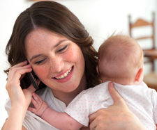 mom holding baby on the phone