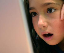 girl at computer shocked