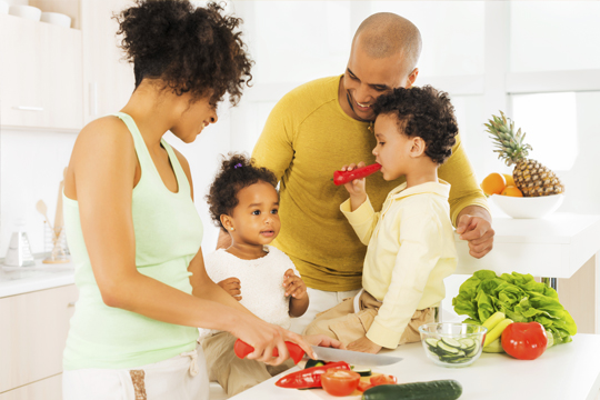Cheerful family preparing food in the kitchen