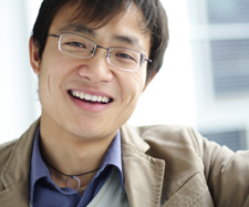 man with glasses smiling