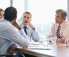 Coworkers having a discussion in a meeting Coworkers having a discussion in a meeting