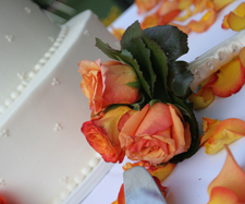 flowers next to a wedding cake